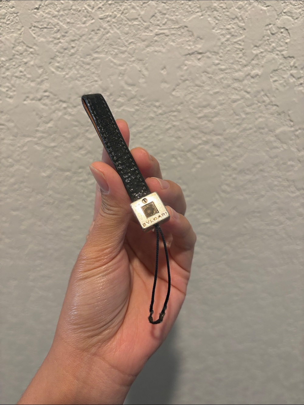 Bvlgari Black Leather Phone Strap Charm with Metal Accent